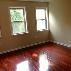 wood floor living room at The Courts has two great locations featuring newly renovated apartment homes. Minutes to downtown DC