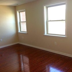 wood floor living room at The Courts has two great locations featuring newly renovated apartment homes. Minutes to downtown DC